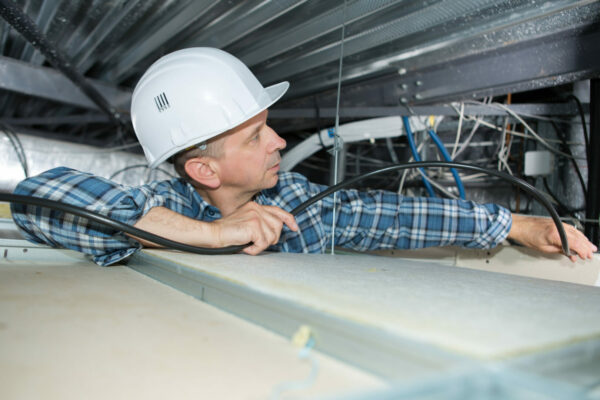 Worker performing task in confined space